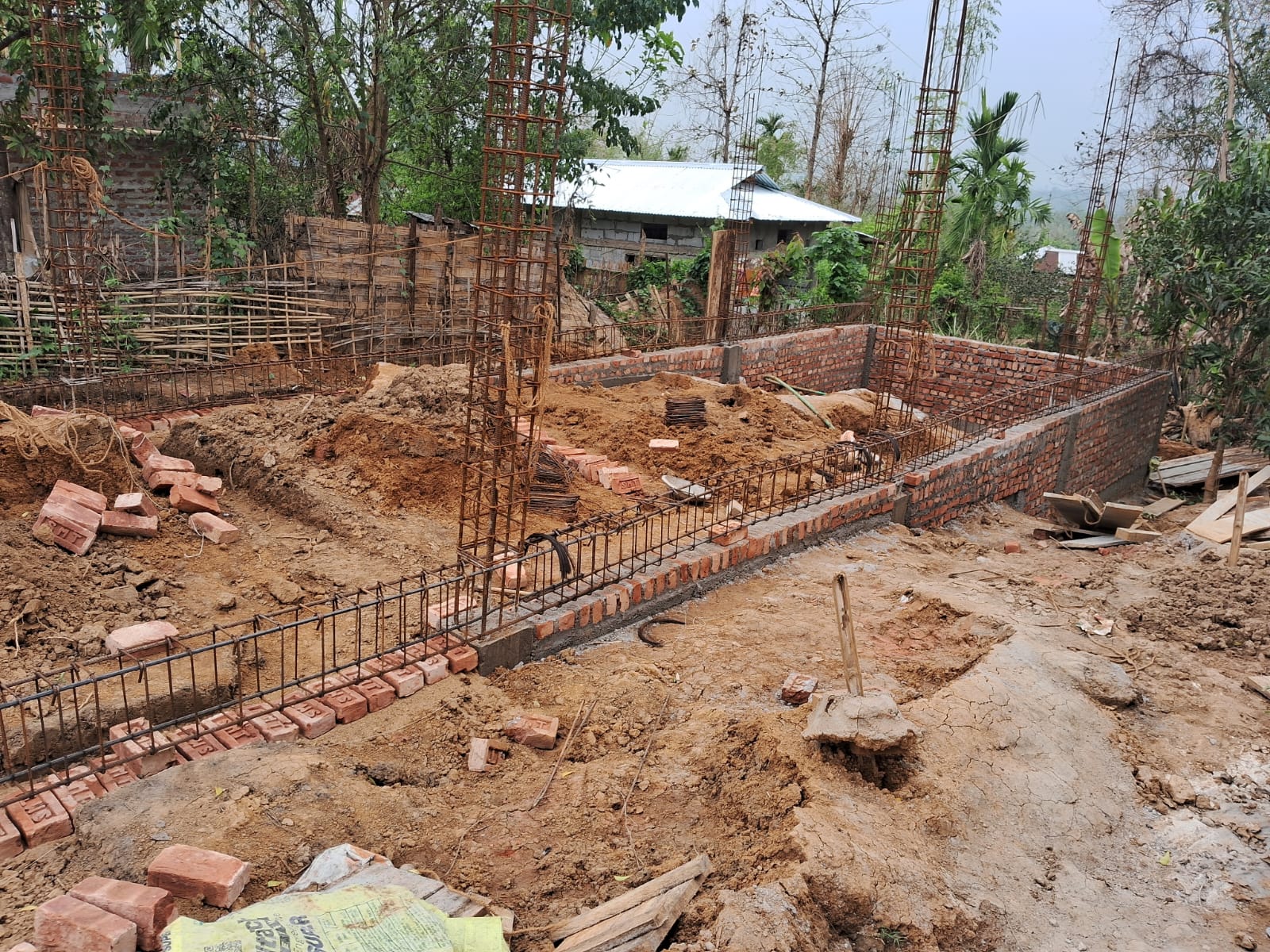 Hostel foundation with brickwork and rebar columns at Langting, Assam