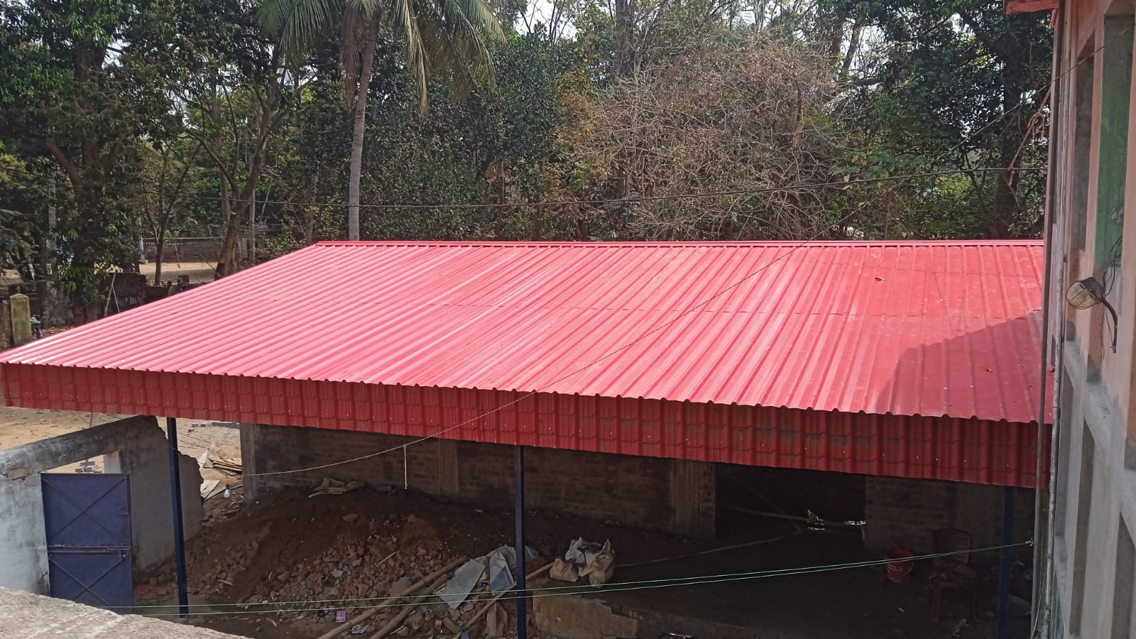 Prayer hall with red corrugated roof at Sevayatana, Jhargram